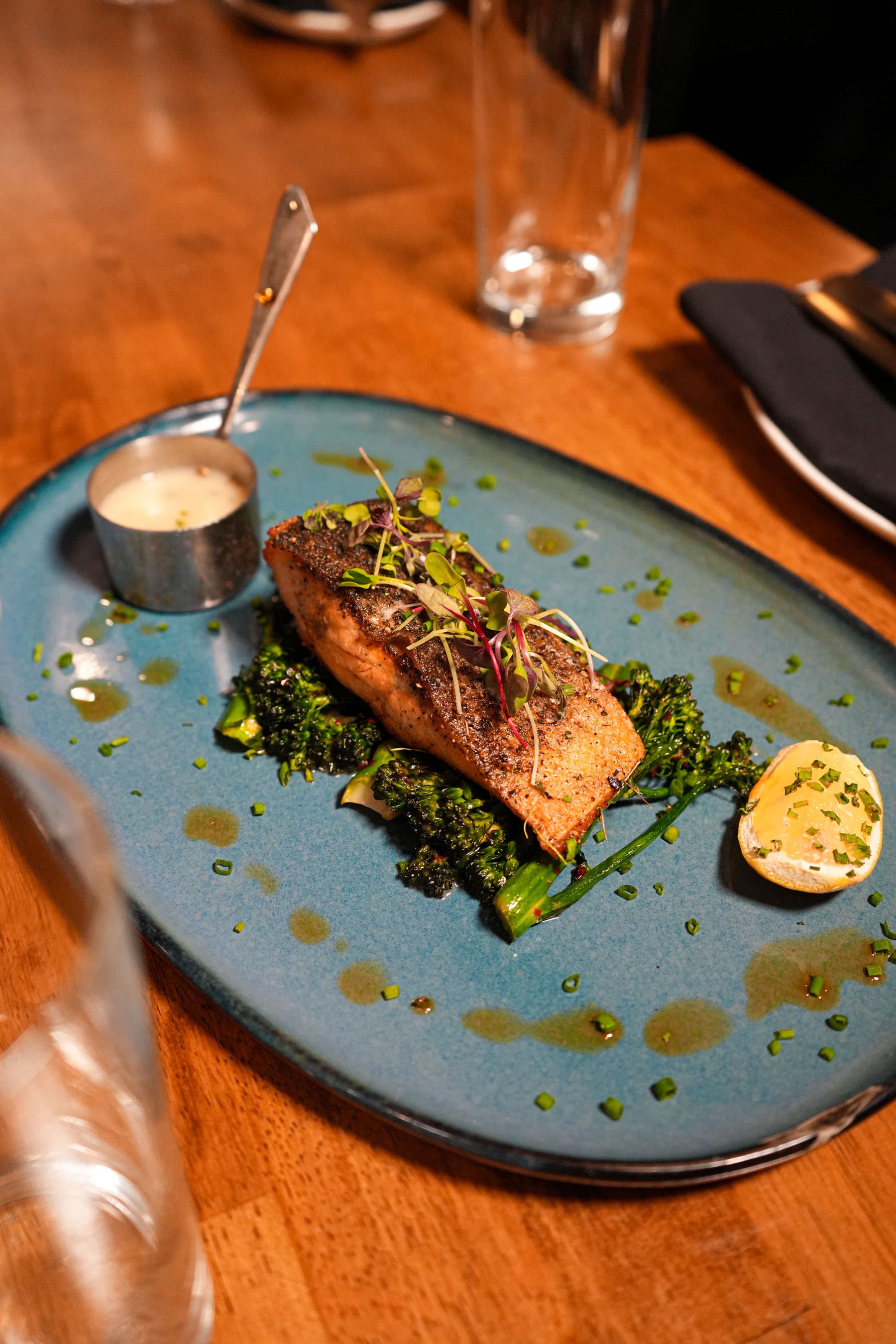 Siren's salmon entrée plated with seasonal accompaniments